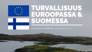 Kuvassa on vuoria ja tunturia. Tekstissä lukee Turvalisuus Euroopassa ja suomessa. Tampereella 27.11.2021. Tekstin viereen on lisätty sininen EU lippu, jossa tähtiä, sekä valko-sininen Suomen lippu.
